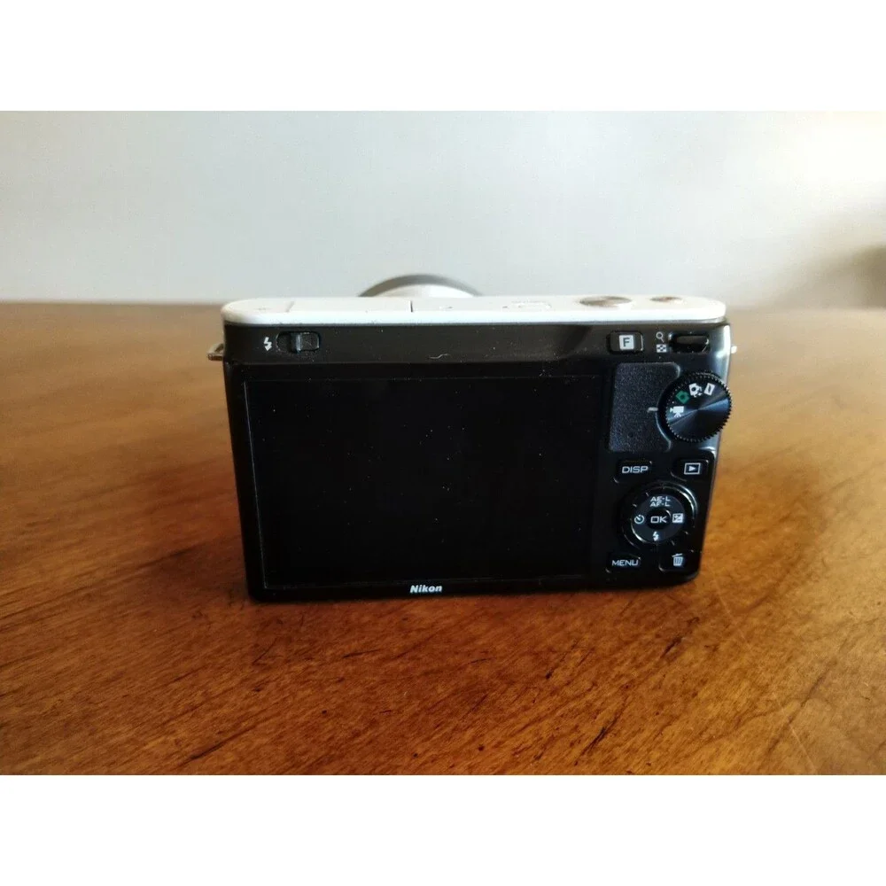 READ* Nikon 1 J1 White Digital Camera with 1 NIKKOR 10-30mm VR Lens